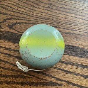 Classic vintage wooden Yo-Yo in Mint Green and Yellow.